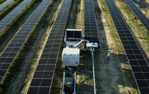 A small machine that looks to be installing solar panels